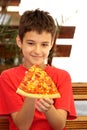 A boy eating pizza Royalty Free Stock Photo