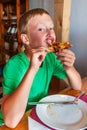 Boy eating pizza Royalty Free Stock Photo