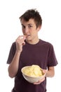 Boy eating potato crisps