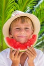 Boy eating red ripe watermelon. Summertime, holidays and vacations concept Royalty Free Stock Photo