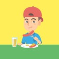 Boy eating sausage and fried egg for breakfast. Royalty Free Stock Photo