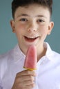 Boy eating self home made fruit strawberry and grape fruit icecream Royalty Free Stock Photo