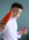 Boy eating self home made fruit strawberry and grape fruit icecream Royalty Free Stock Photo