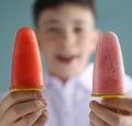 Boy eating self home made fruit strawberry and grape fruit icecream Royalty Free Stock Photo