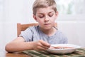 Boy eating soup