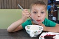 Boy eating vareniki