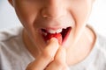 Boy eating a very tasty strawberry on a light background. Close up Royalty Free Stock Photo