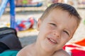 The boy eats a donut on the beach Royalty Free Stock Photo