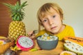 Boy eats fruit. Healthy food for children. Child eating healthy snack. Vegetarian nutrition for kids. Vitamins for Royalty Free Stock Photo