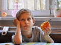 Boy eats a pear Royalty Free Stock Photo