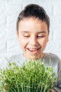 Boy eats peas microgreen, spring avitaminosis