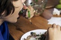 boy eats vegetable salad with a for Royalty Free Stock Photo