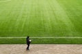 The boy at the edge of a football field Royalty Free Stock Photo