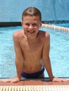 Boy on the edge of swimming pool Royalty Free Stock Photo