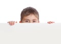 Boy emerge from behind poster