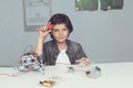 The boy is engaged in the construction of a robot. He sits next to the robot and shows a robot in the camera