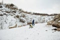 Boy enjoy a sleigh ride. Child sledding. Kid riding a sledge on winter Royalty Free Stock Photo