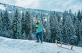 Boy enjoy a sleigh ride. Child sledding, riding a sledge. Children play in snow in winter. Outdoor kids fun for Royalty Free Stock Photo