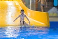 Boy enjoying water slide Royalty Free Stock Photo