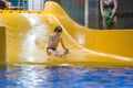 Boy enjoying water slide Royalty Free Stock Photo