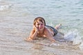 Boy enjoys lying at the beach Royalty Free Stock Photo