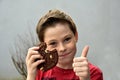 Boy enjoys chocolate pastry with nuts Royalty Free Stock Photo