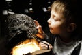 Boy examines natural mineral