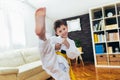 Boy exercising at home in living room Royalty Free Stock Photo