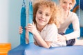 Boy exercising on swing platform Royalty Free Stock Photo