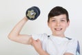 Boy using dumbbell weights Royalty Free Stock Photo