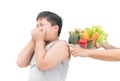 Boy with expression of disgust against vegetables Royalty Free Stock Photo