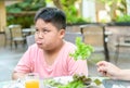 Boy with expression of disgust against vegetables Royalty Free Stock Photo