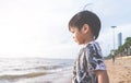 Boy facing out to the sea on a Vacation Beach