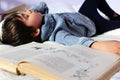 Boy Falling asleep while reading