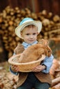 The boy on the farm with a rabbit