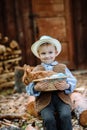 The boy on the farm with a rabbit