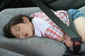 Boy fasten seat belt sleeping