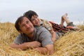The boy and father on hay