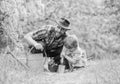 Boy and father in nature with watering can. Gardening tools. Planting flowers. Dad teaching little son care plants Royalty Free Stock Photo