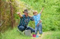 Boy and father in nature with watering can. Spring garden. Dad teaching little son care plants. Personal example. Little