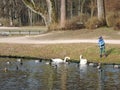 Boy feeding birds, Lithuania