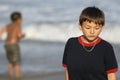 Boy Feeling Sad at the Beach Royalty Free Stock Photo