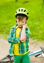 Boy fell from the bike in a park