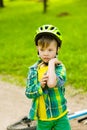 Boy fell from the bike in a park