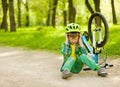 Boy fell from the bike in a park