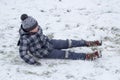 Boy fell on snow,boy slipped on the ice and fell into the snow Royalty Free Stock Photo