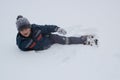 Boy fell to the snow Royalty Free Stock Photo