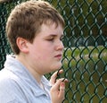 Boy in fence Royalty Free Stock Photo