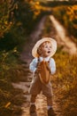 a boy in a field of sunflowers eats wheat bread Royalty Free Stock Photo