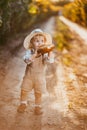 a boy in a field of sunflowers eats wheat bread Royalty Free Stock Photo